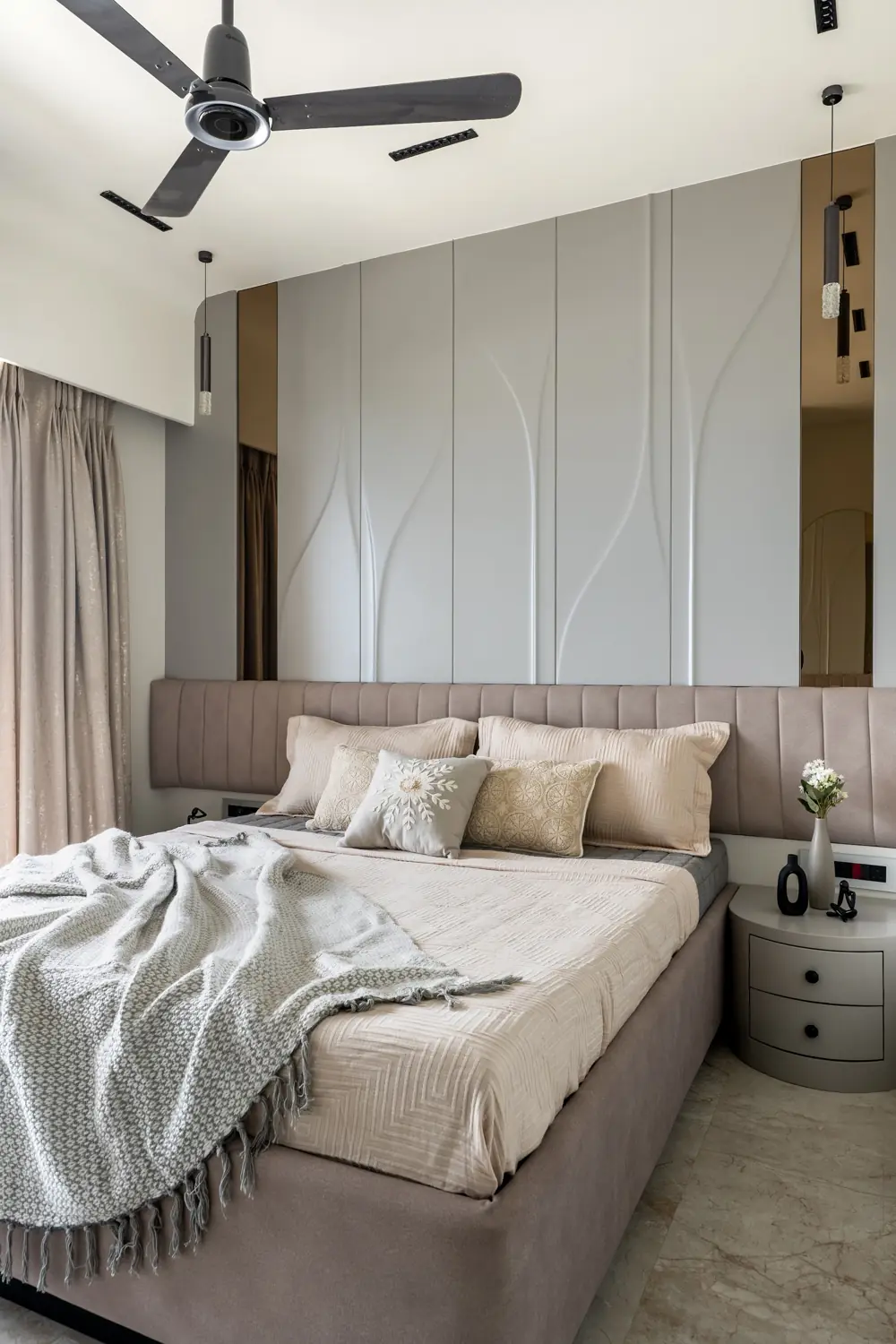 Bedroom with a fluted grey headboard wall