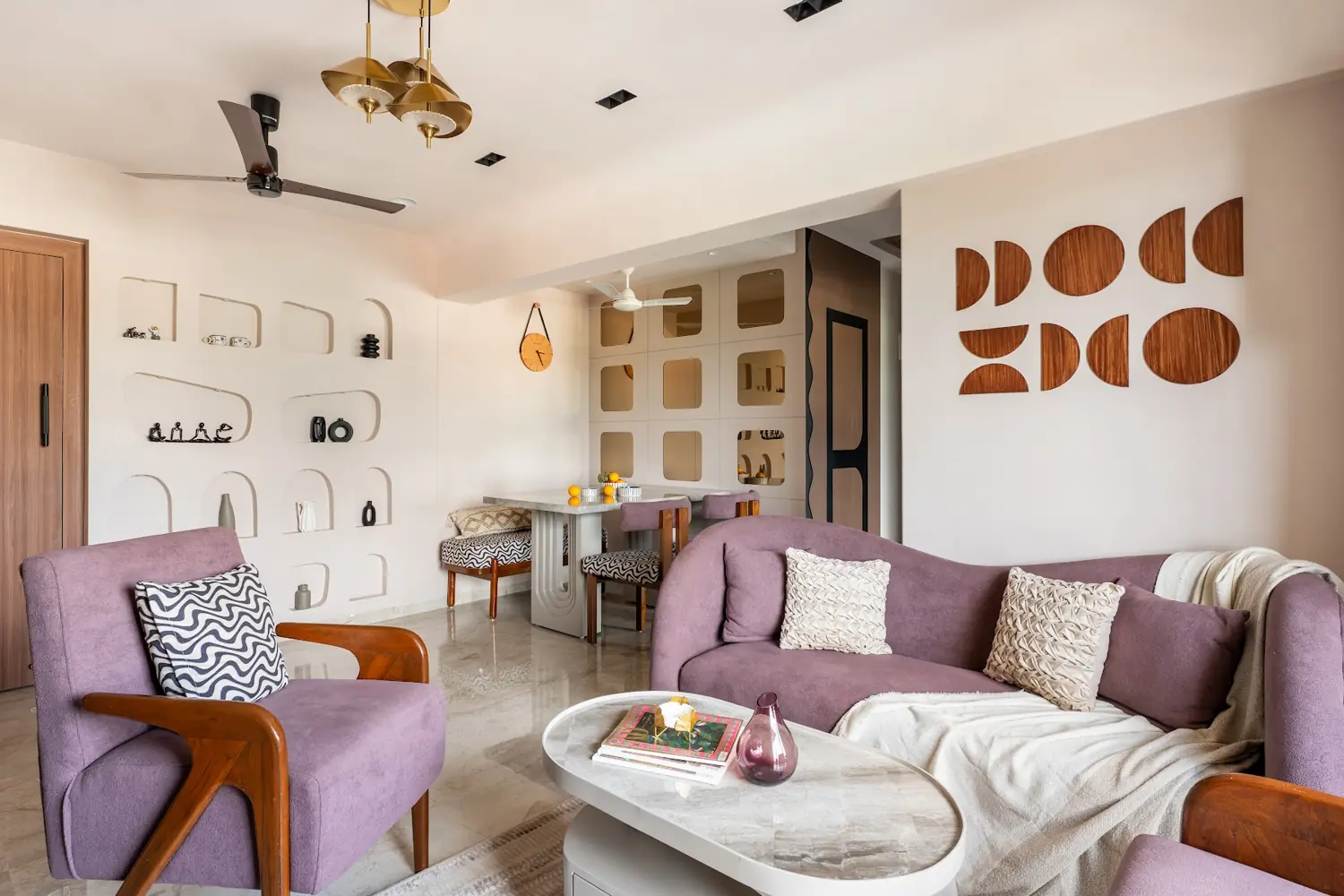 The Alcove House living room in mauve with terracotta cut-out wall art