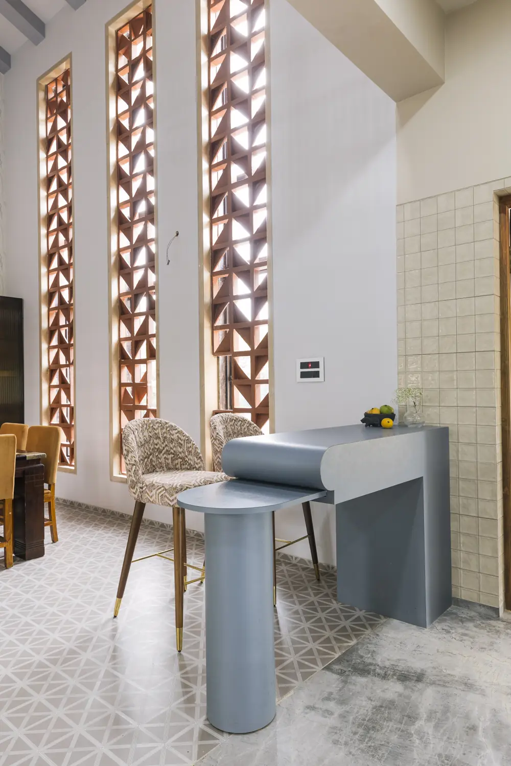 Study corner under three terracotta jaali panels
