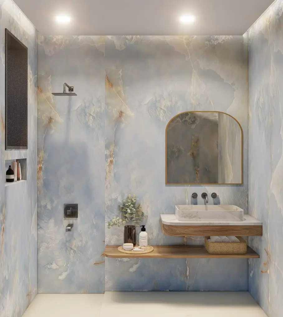 Visual of a blue marble bathroom with an arched mirror