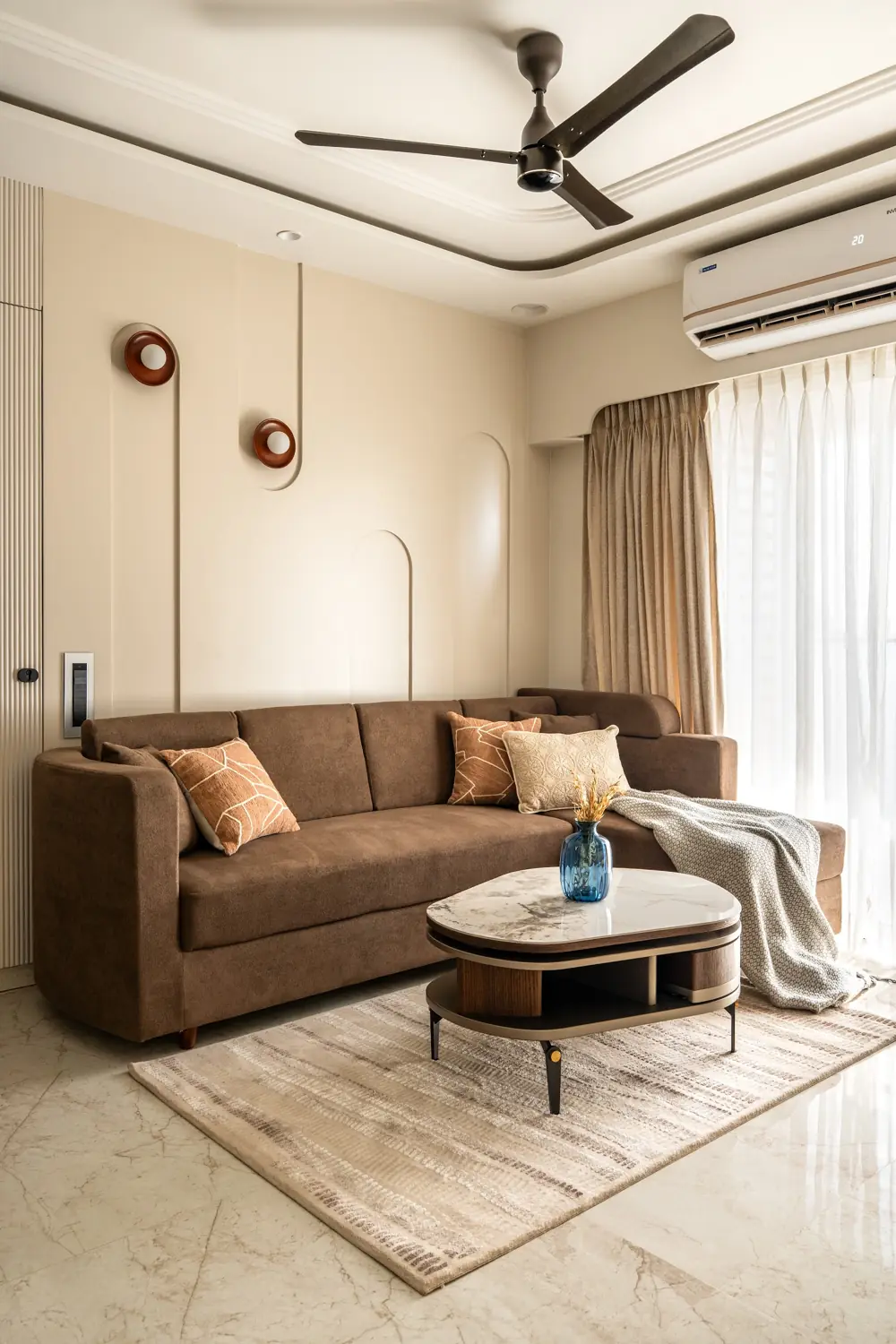 Brown sofa and round wall lights in the living room