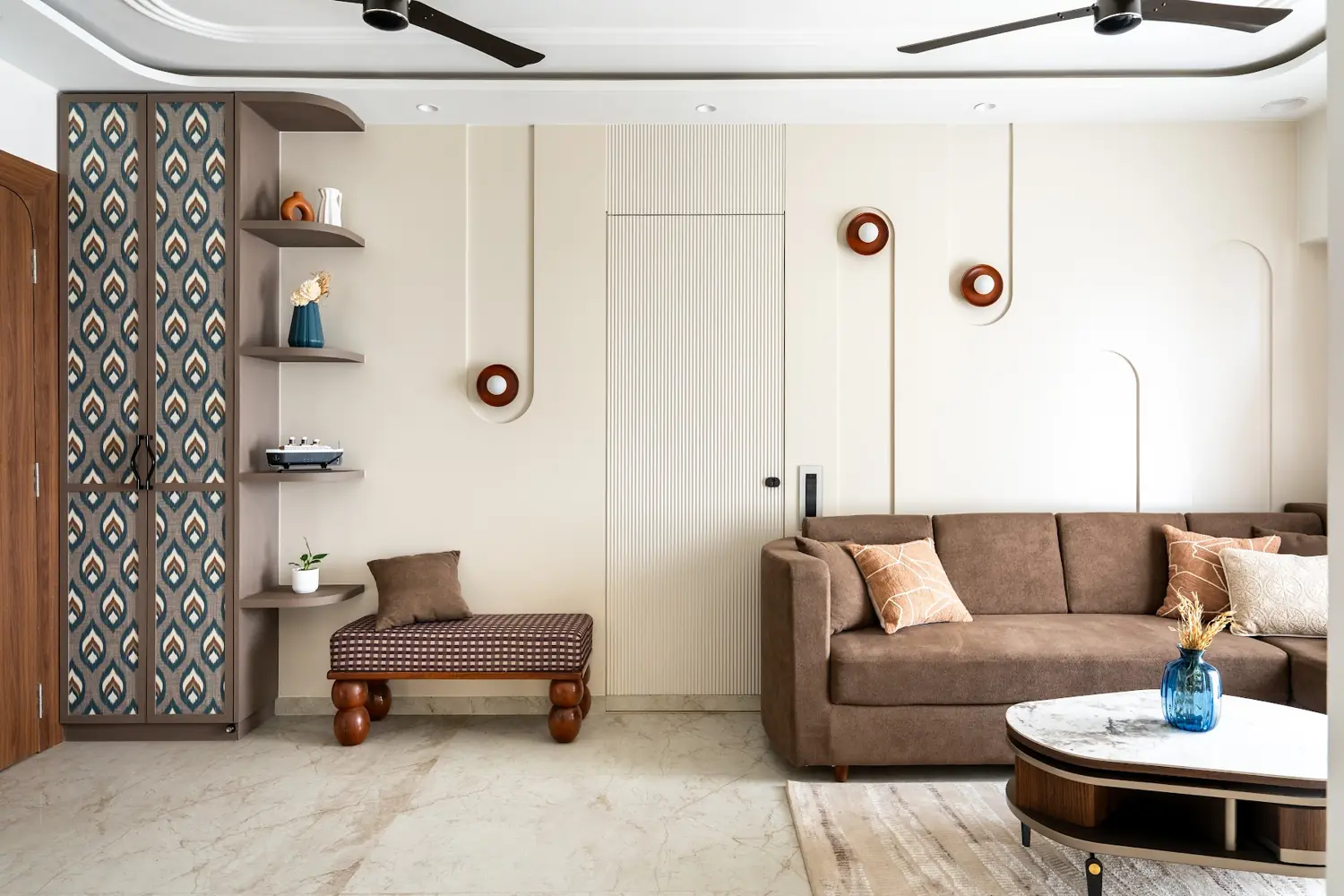 Living room with a jaali screen, floating shelves and a bench