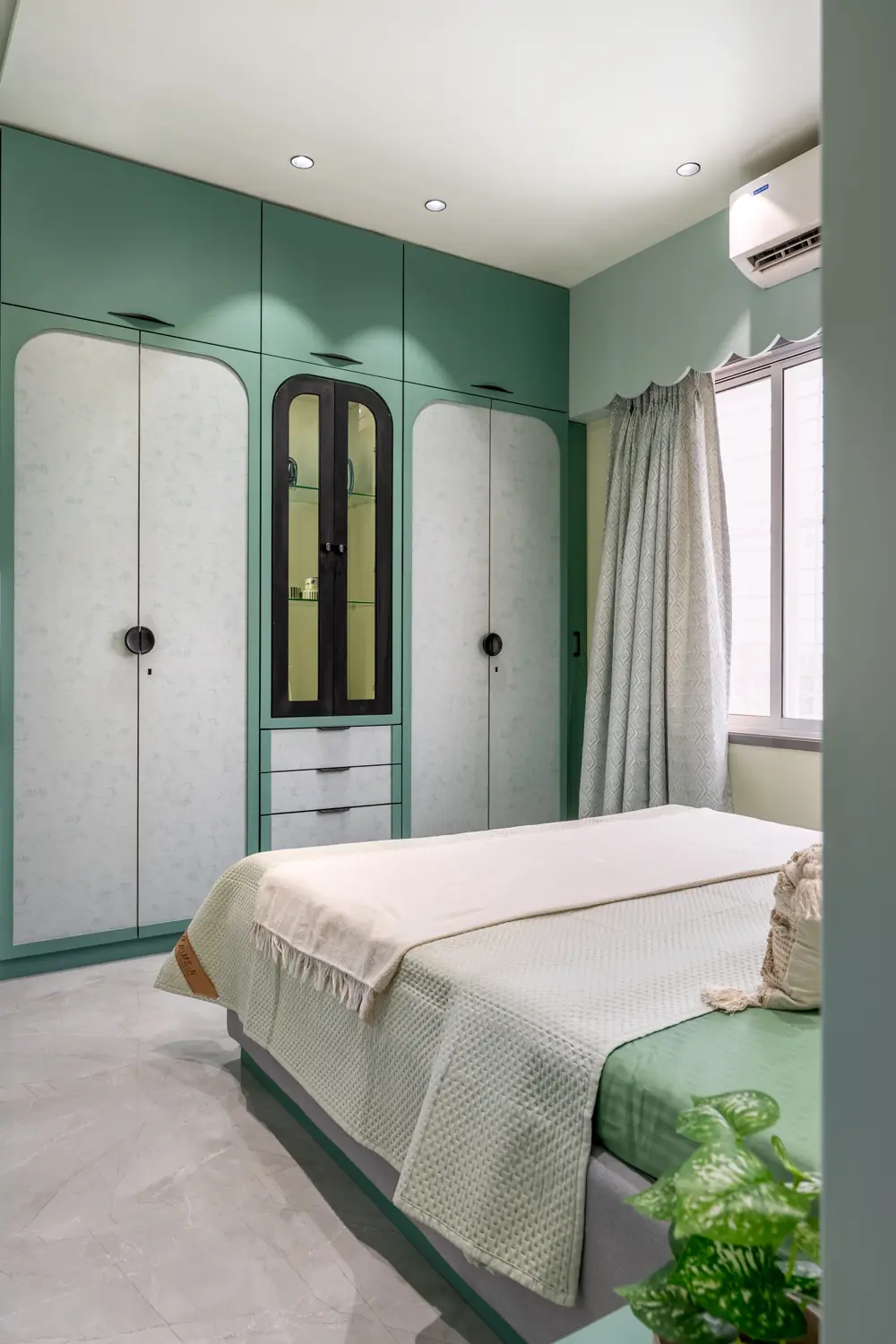 Sage wardrobe with arched glass doors